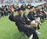 Senior Waving at Graduation
