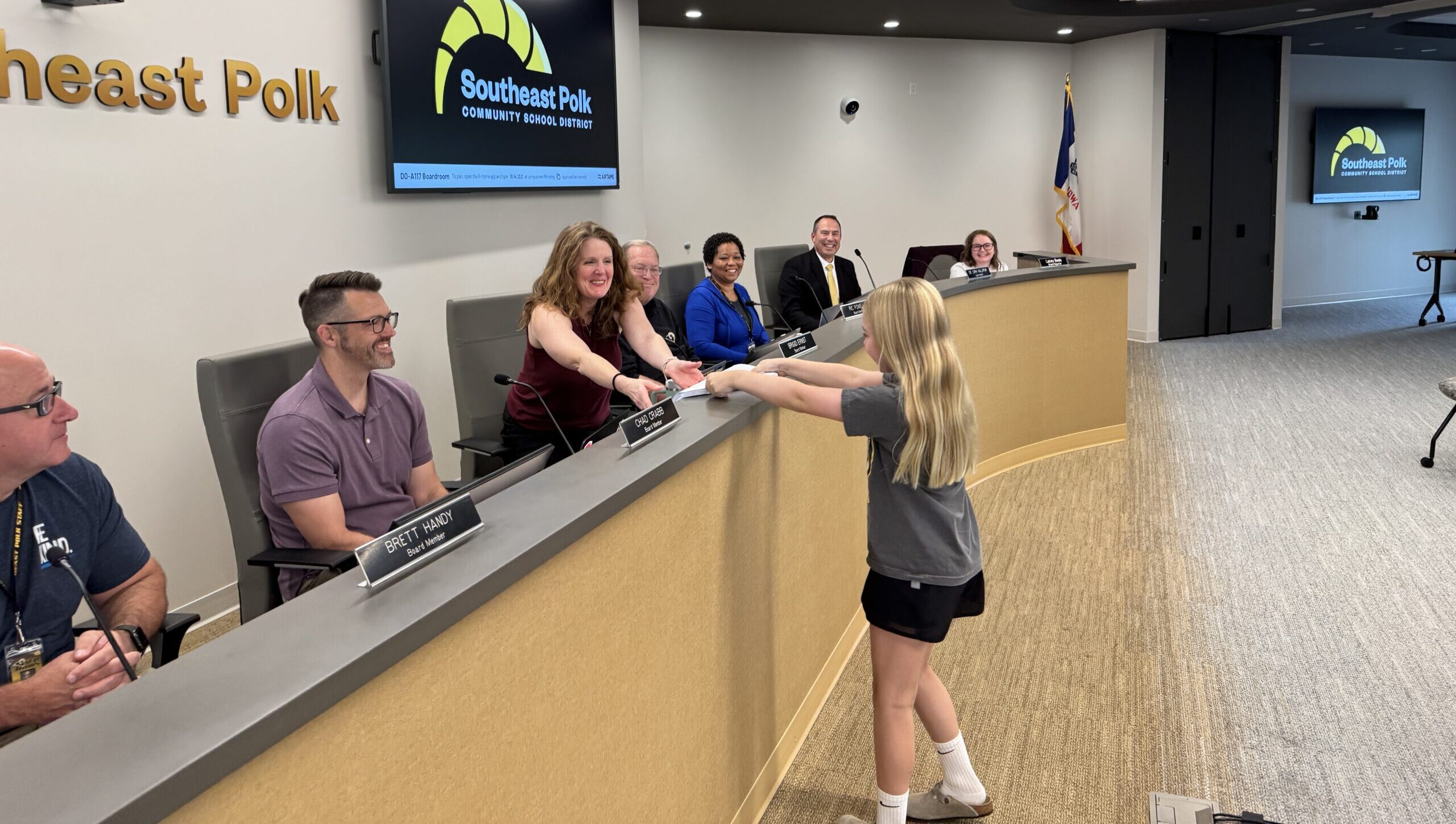 SEP Student Hands Petitions to Board President Ernst