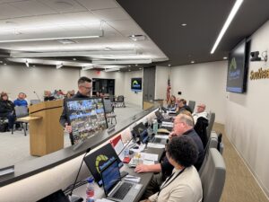 Crabb presenting Powell with photo collage