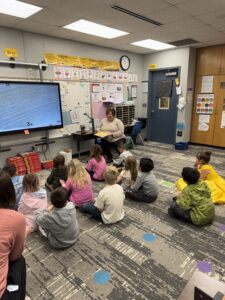 Board member Lori Slings reading to Four Mile preschoolers
