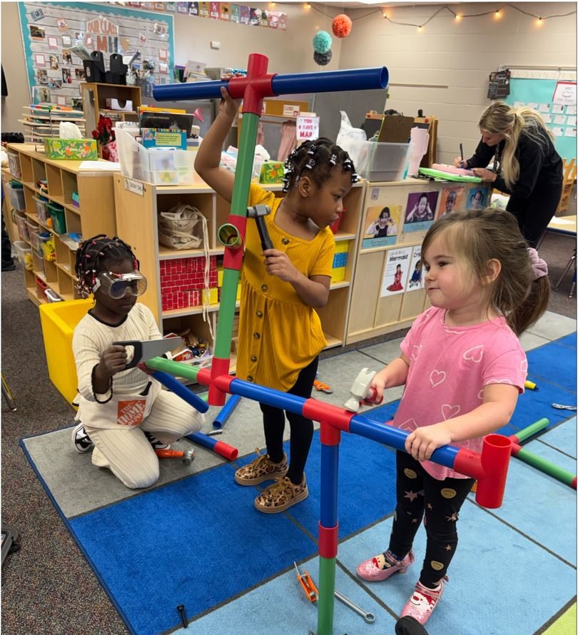 Preschoolers playing with tubes