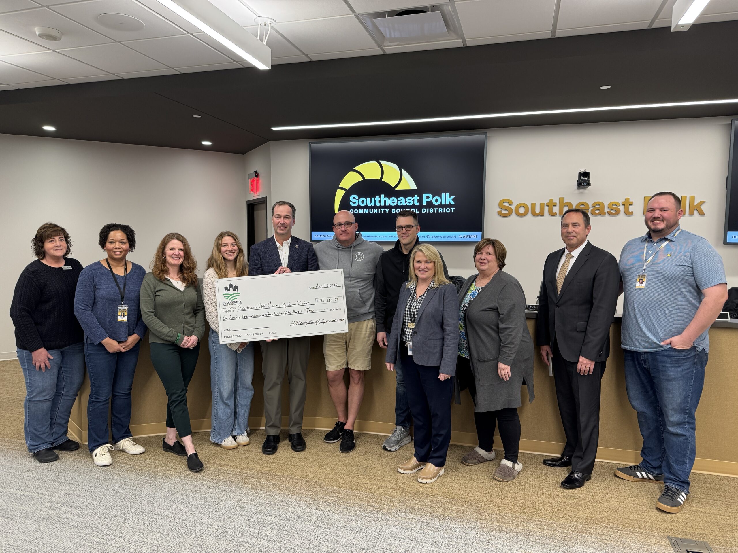 Polk County Supervisors, Prairie Meadows present check to School Board