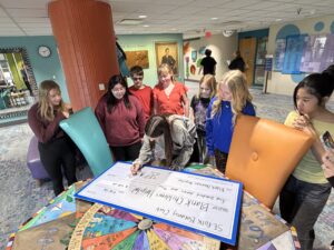 Middle School Students with an oversized check to Blank Childrens Hospital
