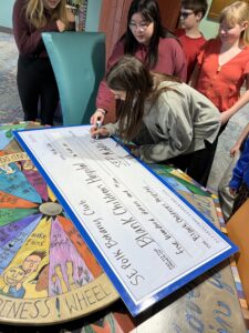 Middle School Students with an oversized check to Blank Childrens Hospital