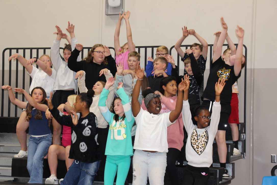 Students Cheering with arms in air