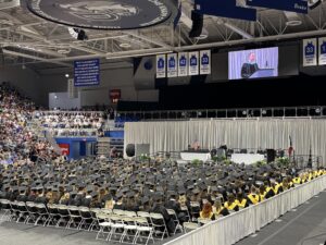 Dirk Halupnik speaking at 2026 Graduation