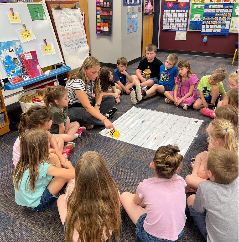 Elyse Carlson in Mrs. Hoyt's Kindergarten classroom at Runnell's Elementary School. She was teaching a lesson on STEM with the programmable Bee-Bots.