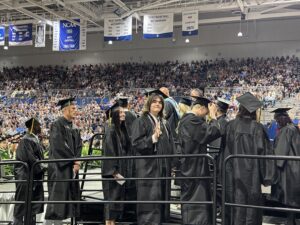 Graduates going on stage