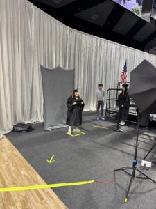 Grace getting her picture taken at 2026 graduation