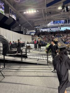 Graduate walking across stage 2026