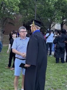 Shaking hands outside after Graduation 2026