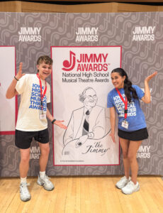 Peyton Haacke poses in front of the Jimmy Awards sign in New York. 
