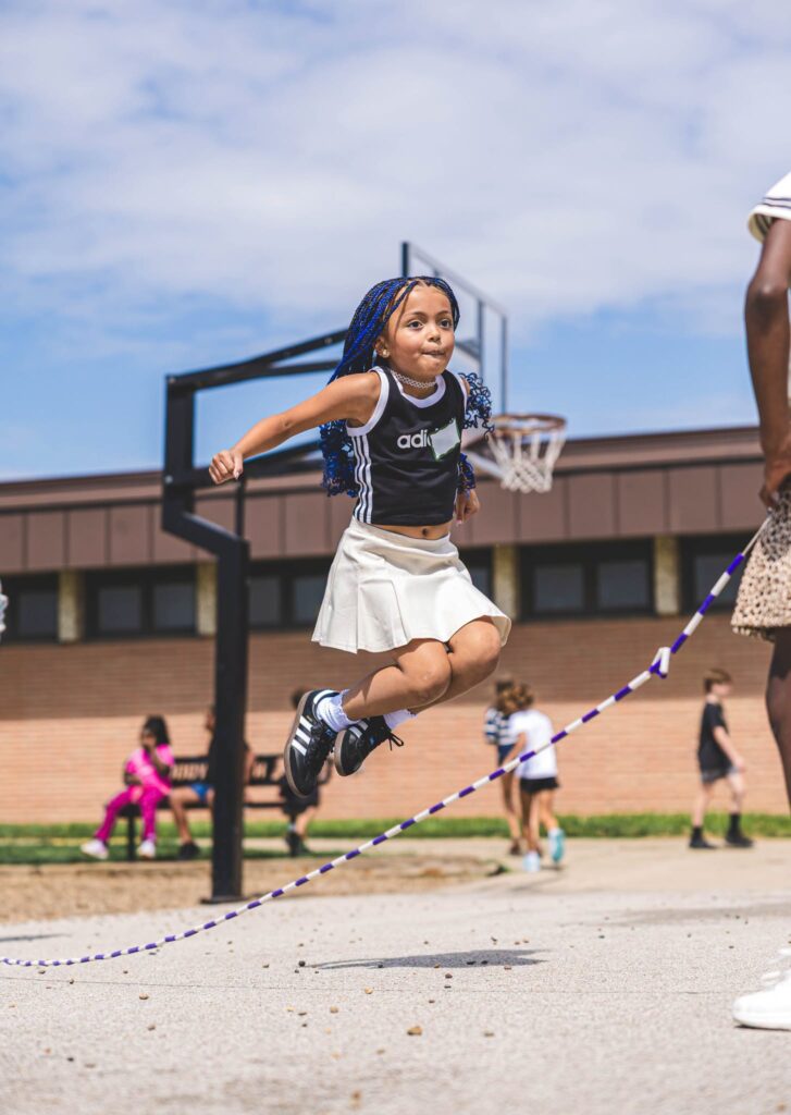 A student jumping rope during recess.