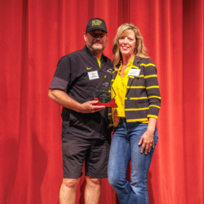 Inductees Josh and Michelle Hanson pose together during the Southeast Polk Hall of Honor induction ceremony on Friday, Oct. 2, 2026. T