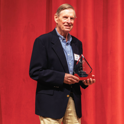 Al Fick poses for a portrait during the Southeast Polk Hall of Honor induction ceremony at Southeast Polk High School on Friday, Oct. 2, 2026. Fick was recognized for his decades of community service, engineering career, and foundational leadership as the first president of the SEP Booster Club.